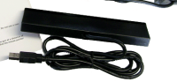 The Aimtrak IR bar, thicker than the Wii's IR bar.